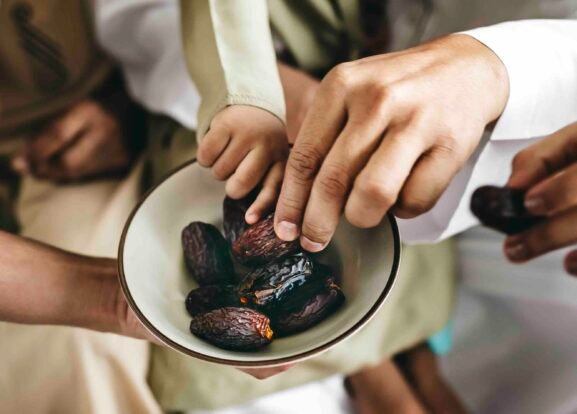 Children enjoying ripened dates